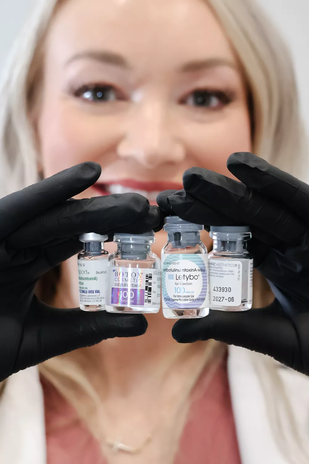 An injector at Modern Medical Aesthetics holding vials of Dysport, Botox Cosmetic and Letybo